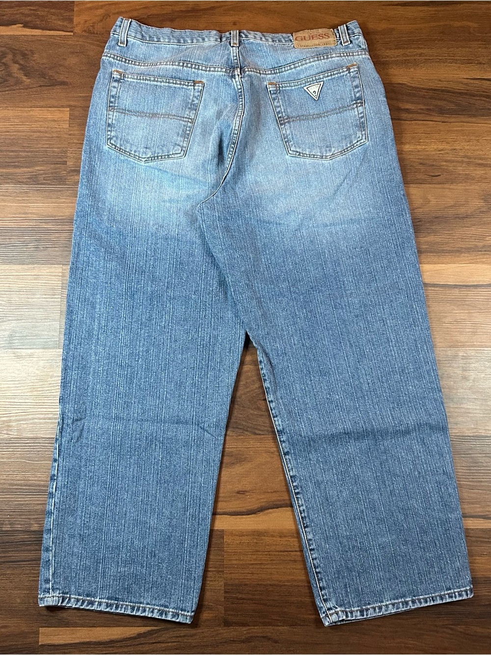 Vintage 90s GUESS Men's Light Blue Relaxed Fit wide leg denim Jeans. 38”